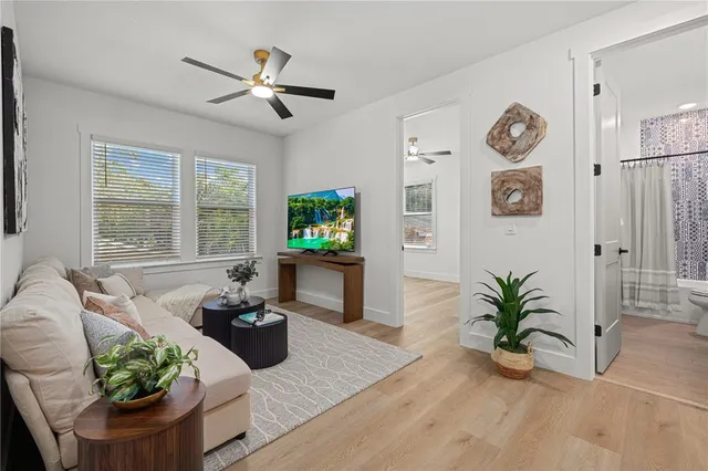 a bathroom with a granite countertop sink a toilet and shower