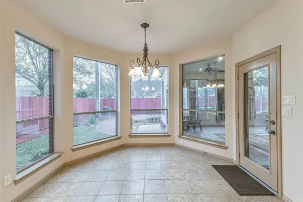 a bathroom with a shower and a glass door