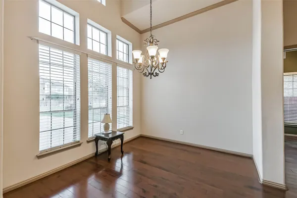 a view of an empty room and a ceiling fan