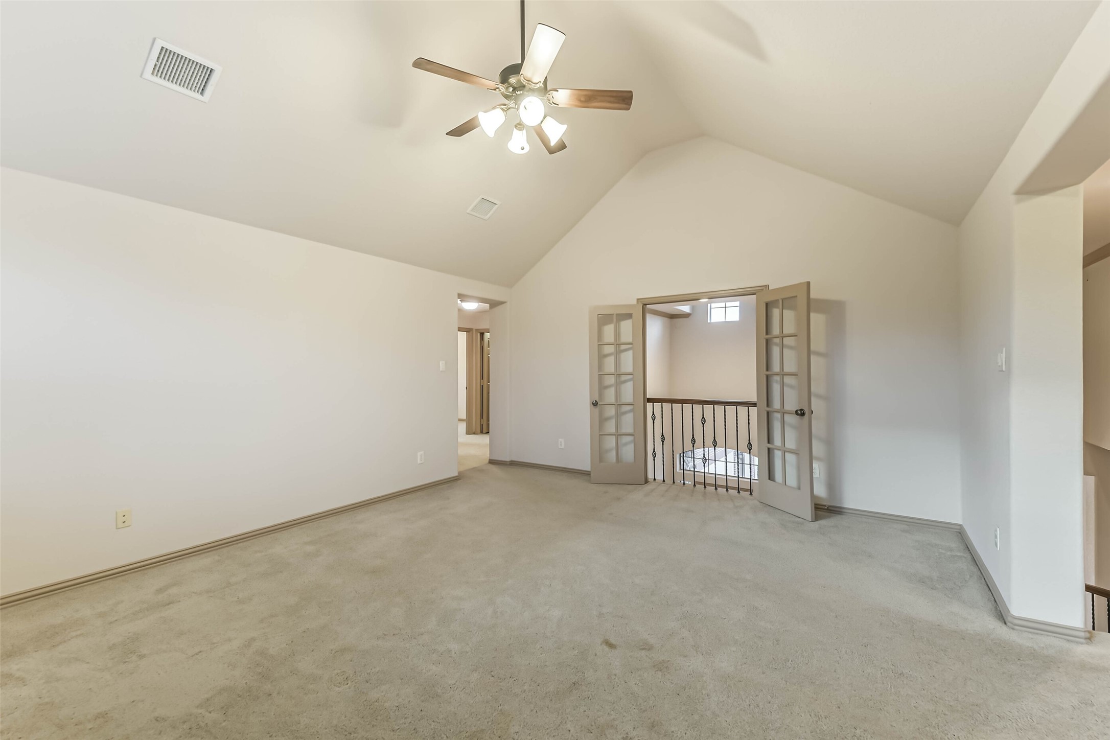 18743 Duke Lake Drive Spring, TX 77388 - Photo 26 of 46 an empty room with chandelier fan and windows