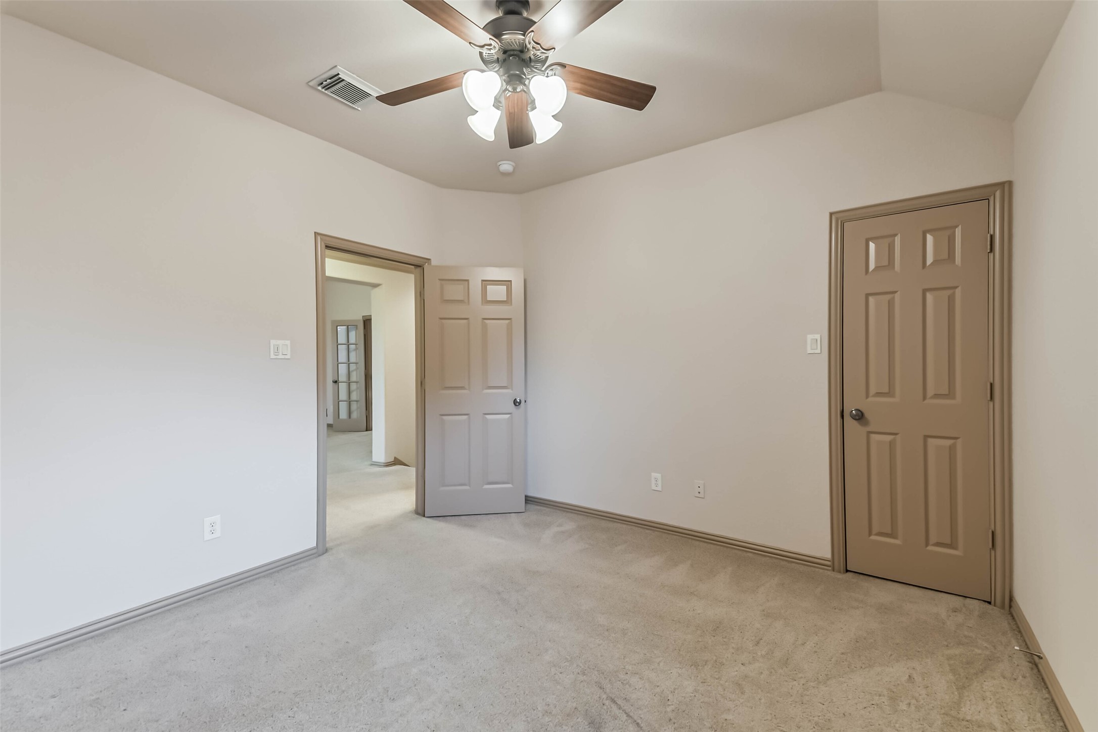 18743 Duke Lake Drive Spring, TX 77388 - Photo 31 of 46 an empty room with chandelier fan and windows