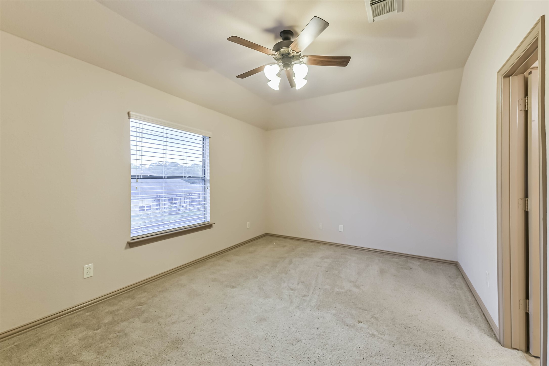 18743 Duke Lake Drive Spring, TX 77388 - Photo 32 of 46 an empty room with windows and fan