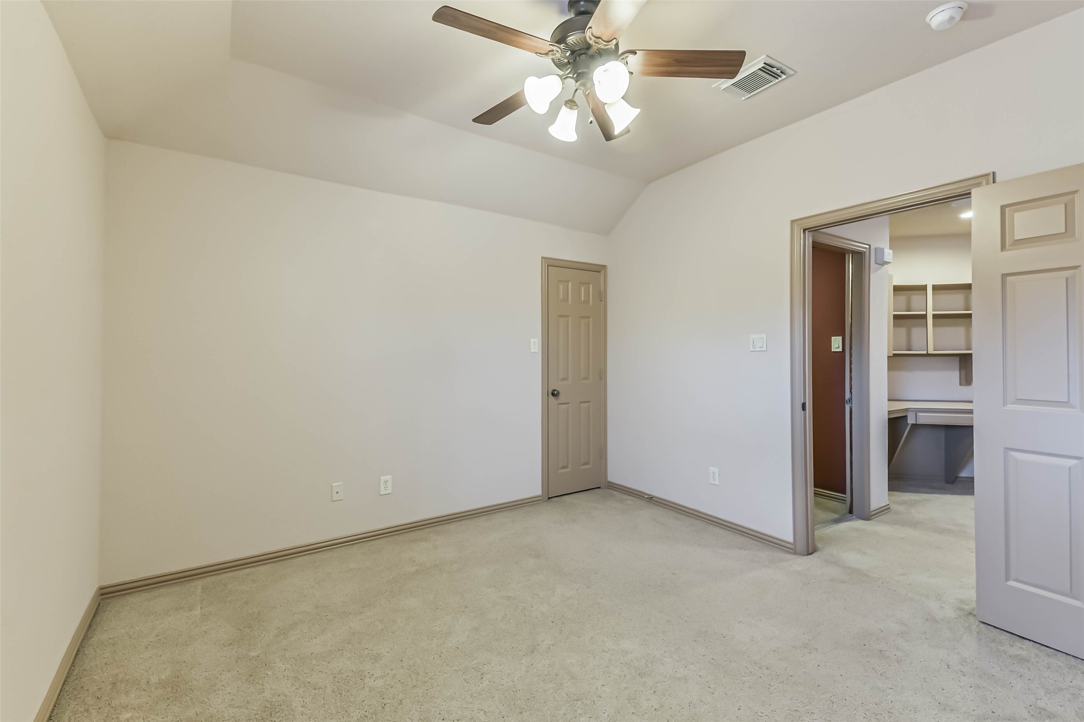 18743 Duke Lake Drive Spring, TX 77388 - Photo 35 of 46 an empty room with closet and a chandelier fan
