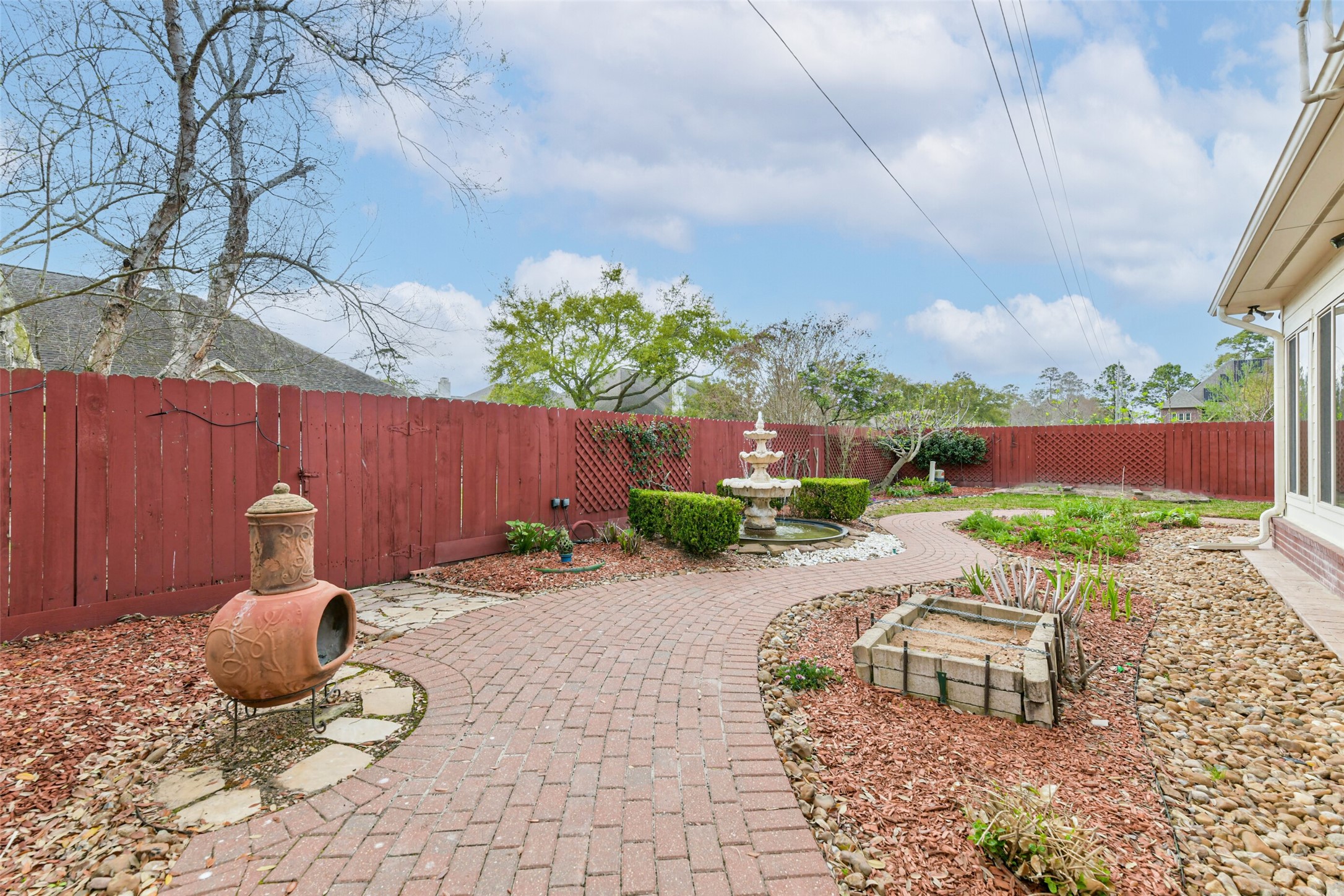 18743 Duke Lake Drive Spring, TX 77388 - Photo 38 of 46 a backyard of a house with table and chairs