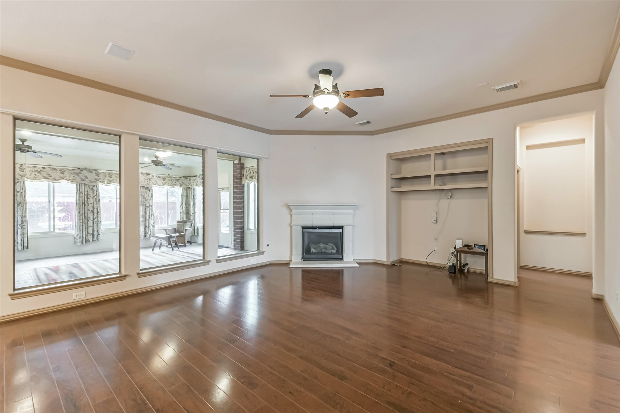 18743 Duke Lake Drive Spring, TX 77388 - Photo 7 of 46 a view of an empty room with a window and wooden floor