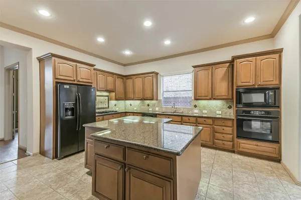 a view of a livingroom with wooden floor and a window