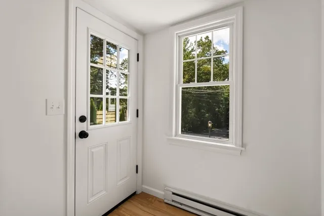 a utility room with window and washer