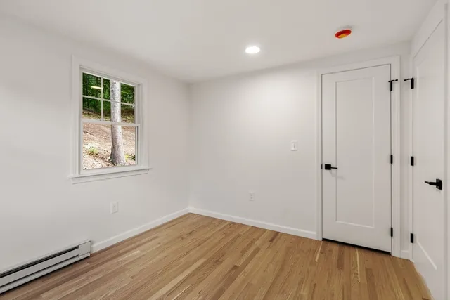 a view of room with wooden floor