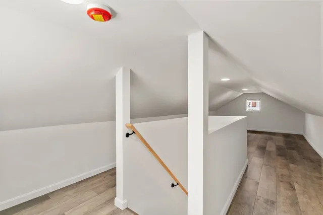 a view of a room with wooden walls