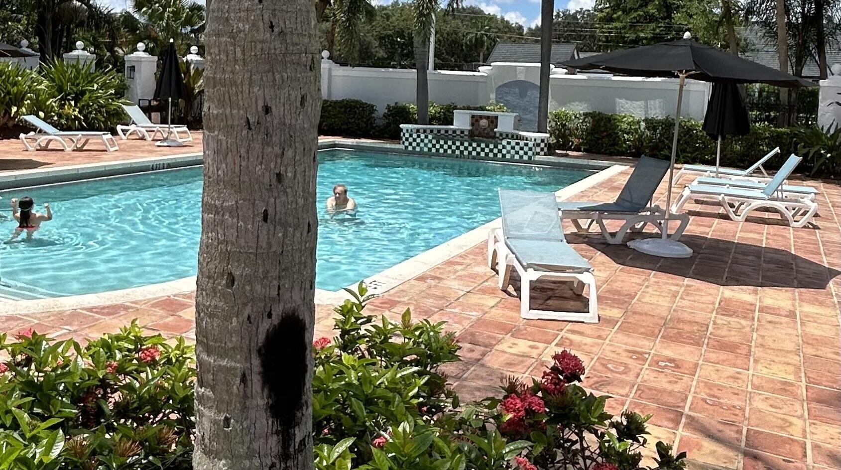 3111 Clint Moore Road, Unit 106 Boca Raton, FL 33496 - Photo 7 of 12 a view of a lake with a patio