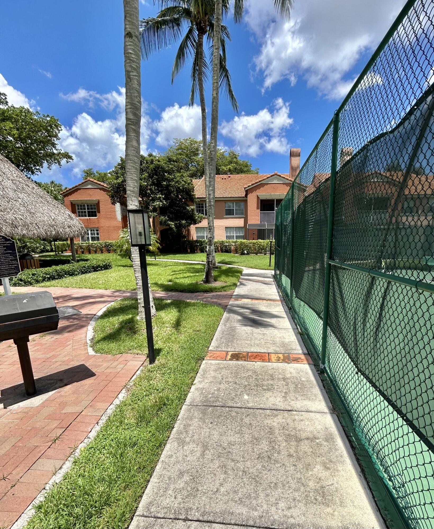 3111 Clint Moore Road, Unit 106 Boca Raton, FL 33496 - Photo 9 of 12 a park with lots of swings and slides