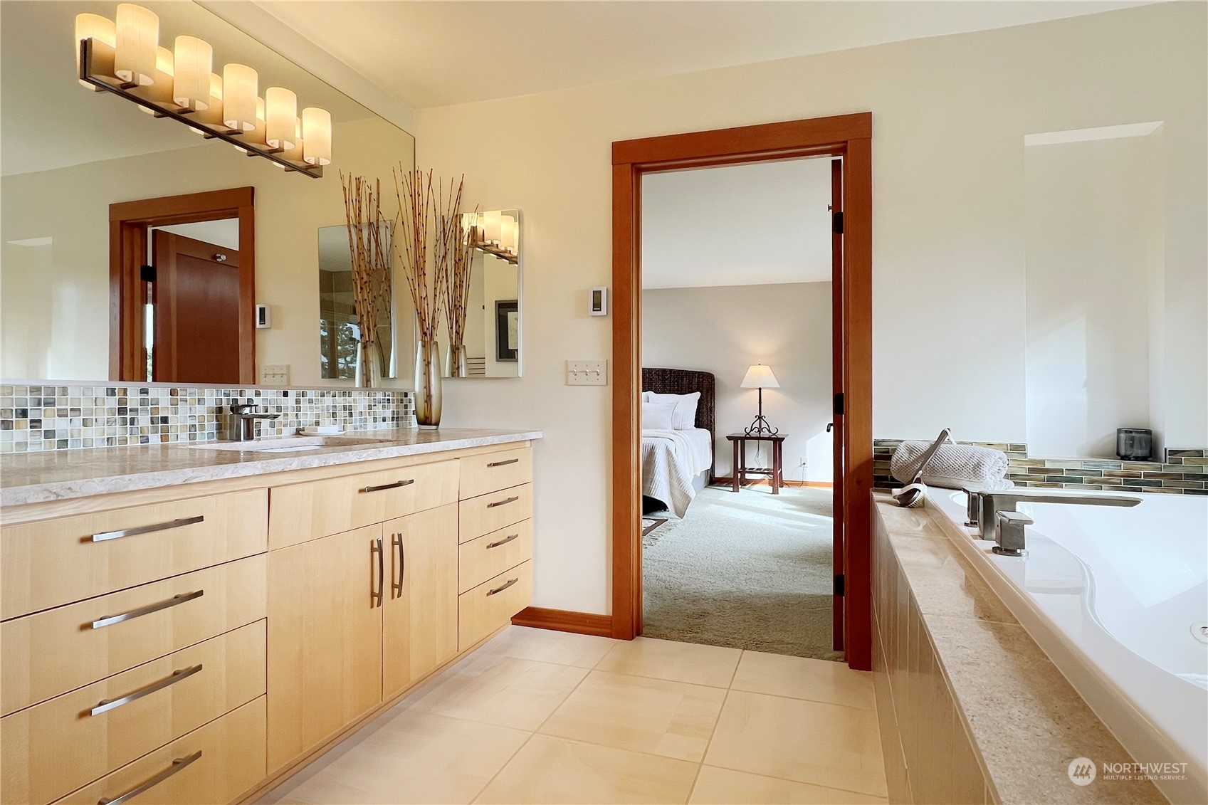 6567 Wahl Road Freeland, WA 98249 - Photo 21 of 40 a spacious bathroom with a granite countertop sink mirror and bathtub