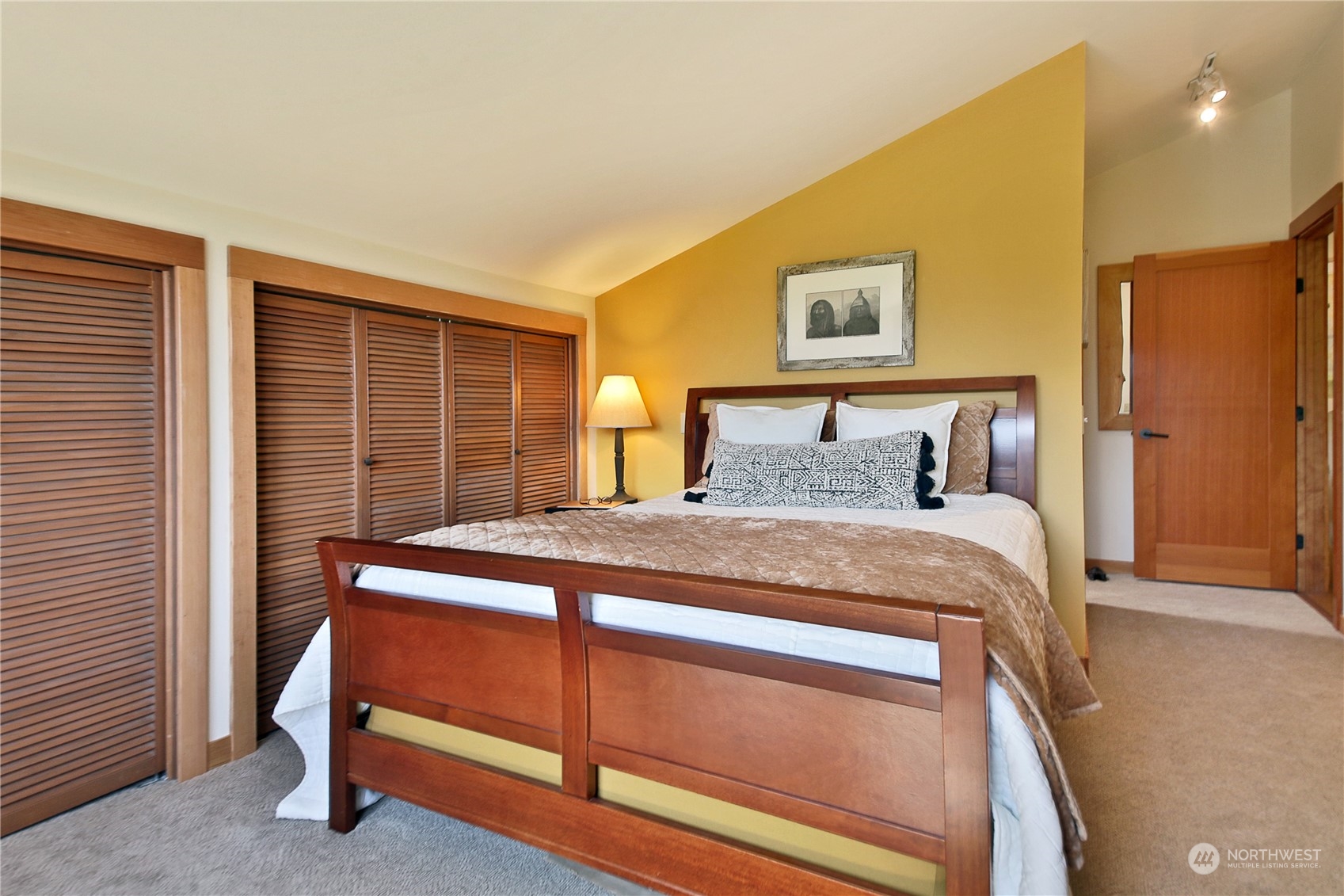 6567 Wahl Road Freeland, WA 98249 - Photo 23 of 40 a bed sitting in a bedroom next to a window