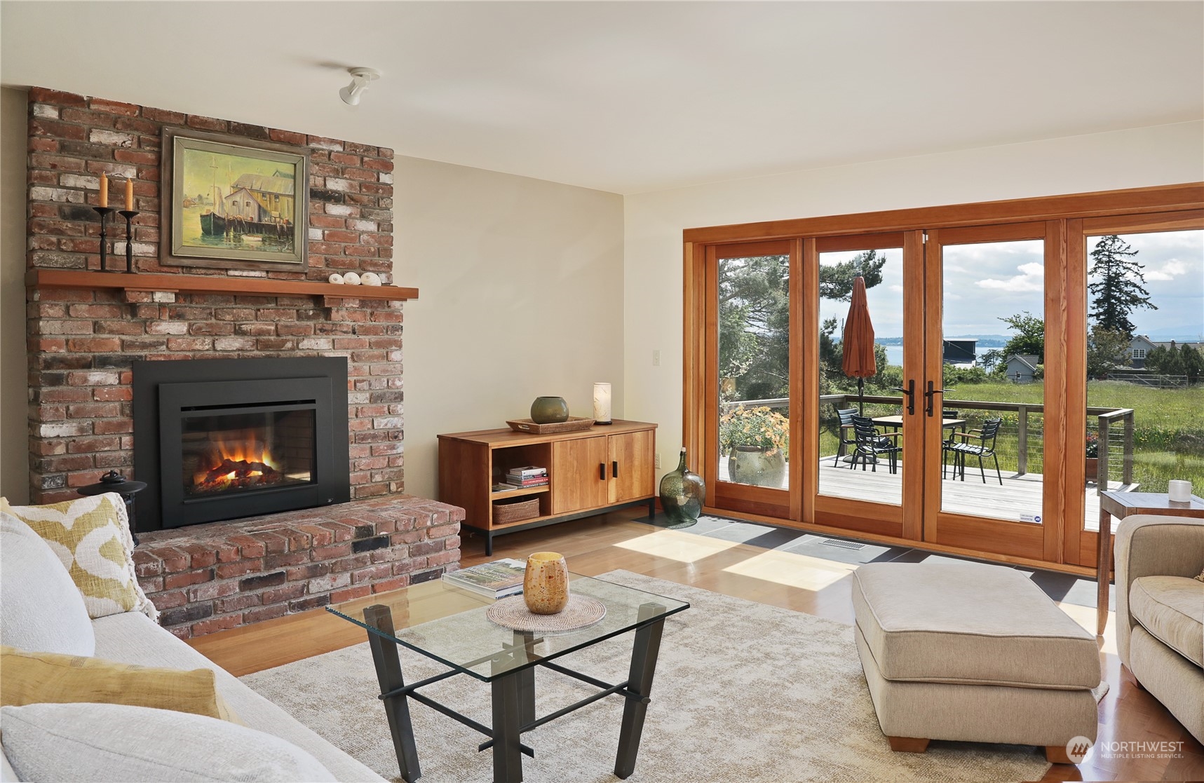 6567 Wahl Road Freeland, WA 98249 - Photo 10 of 40 a living room with furniture and a fireplace