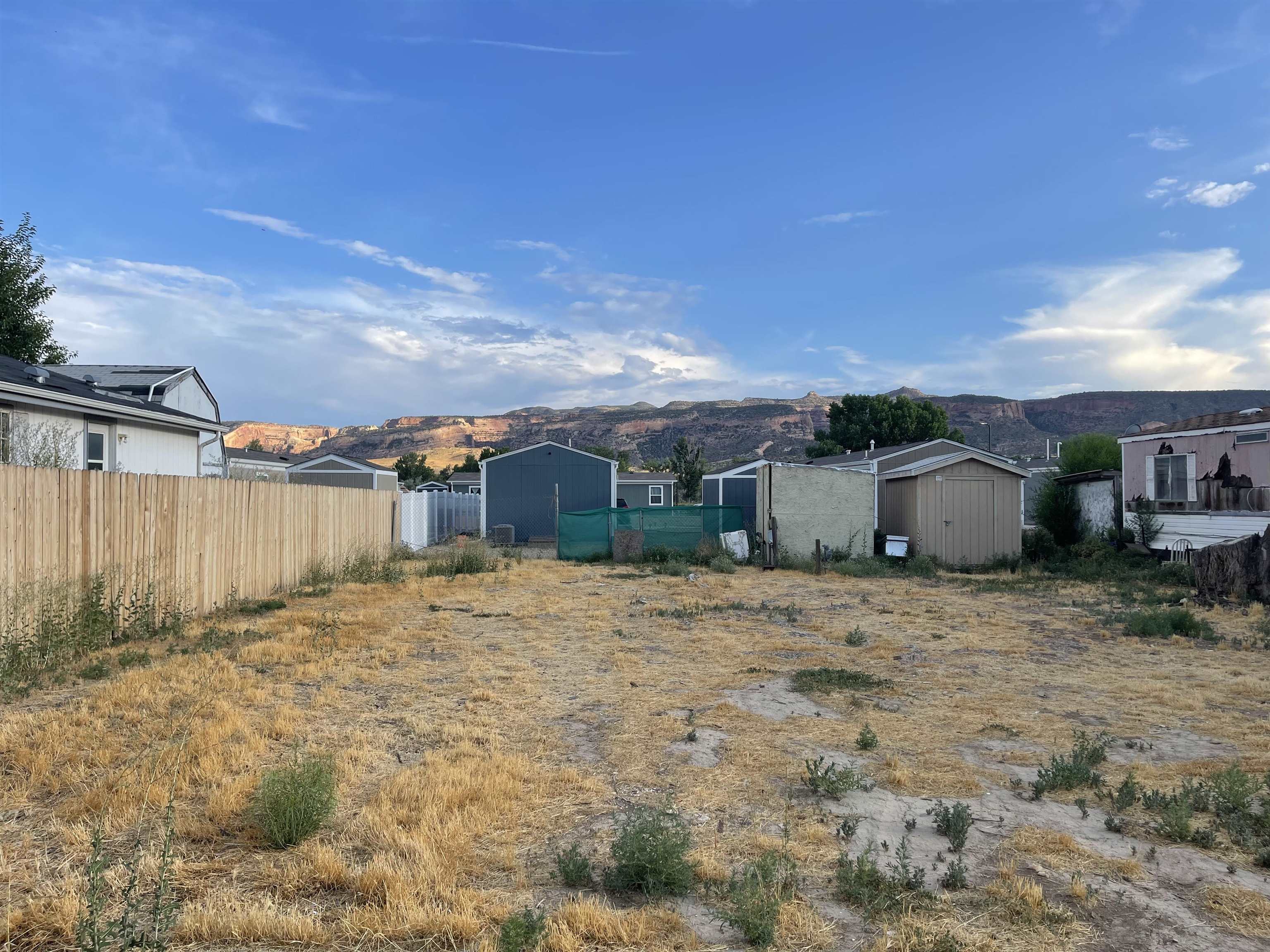 262 Red Cliffs Drive Fruita, CO 81521 - Photo 1 of 4 a row yard with a barn