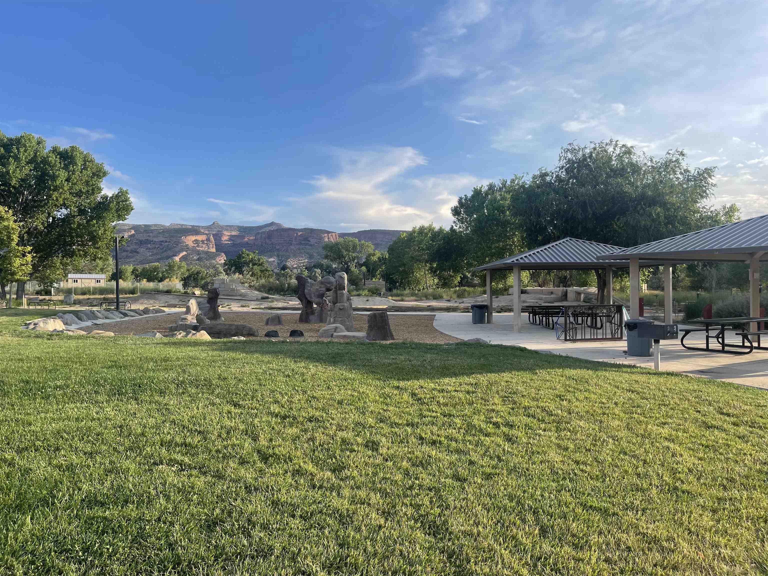 262 Red Cliffs Drive Fruita, CO 81521 - Photo 4 of 4 a view of pool with lawn chairs and large trees