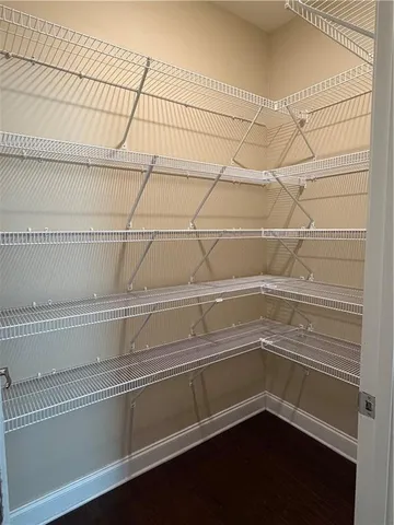 a kitchen with a cabinets and chairs