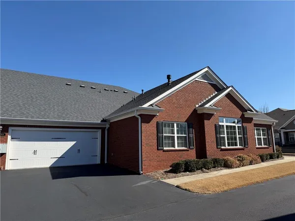 a front view of a house with yard