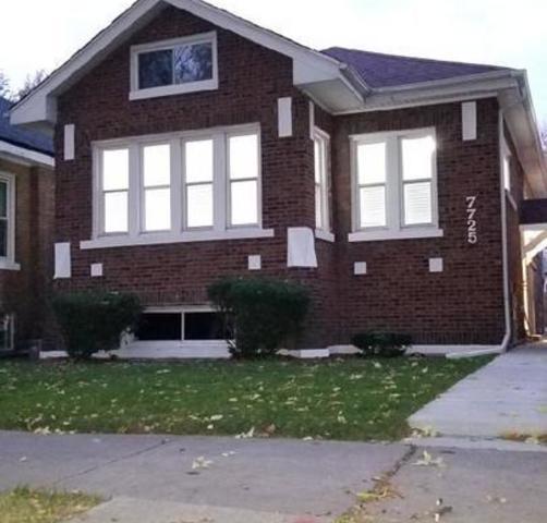 7725 South Honore Street Chicago, IL 60620 - Photo 1 of 1 a front view of a house with a yard