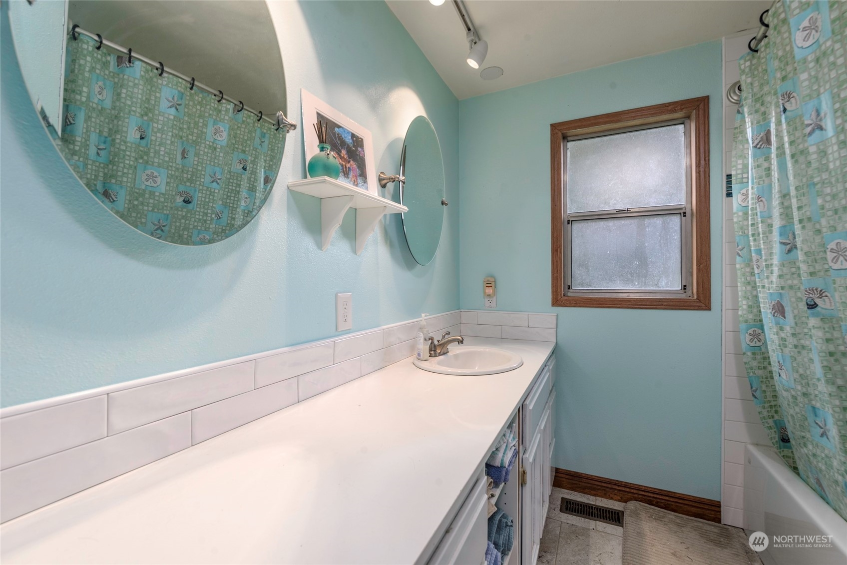 18524 Ivan Street Southwest Rochester, WA 98579 - Photo 10 of 20 a bathroom with a sink and mirror
