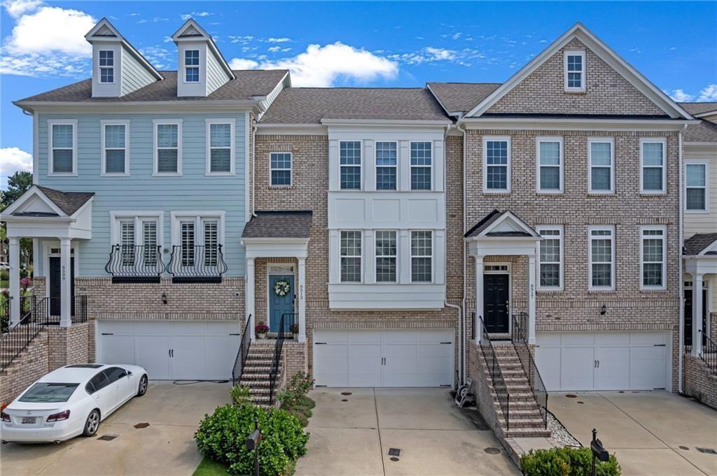 a front view of a house with a garage