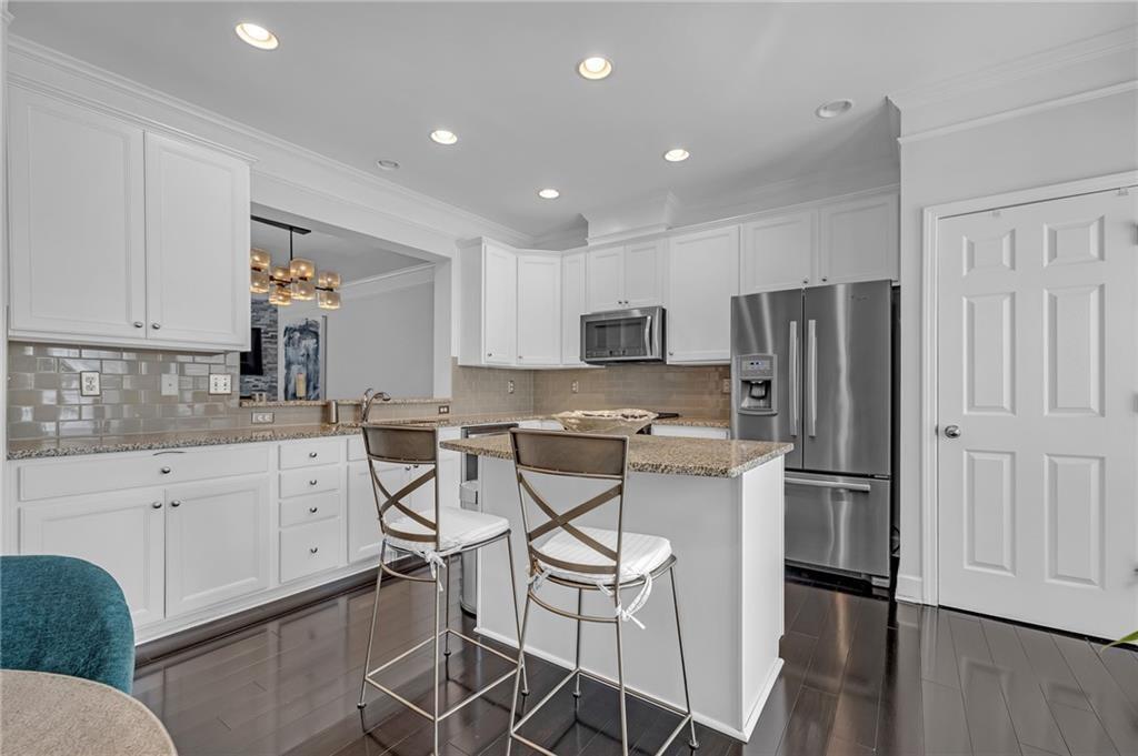 6513 Bennington Bluff Court, Unit 2 Mableton, GA 30126 - Photo 11 of 41 a kitchen with stainless steel appliances a refrigerator stove microwave and cabinets