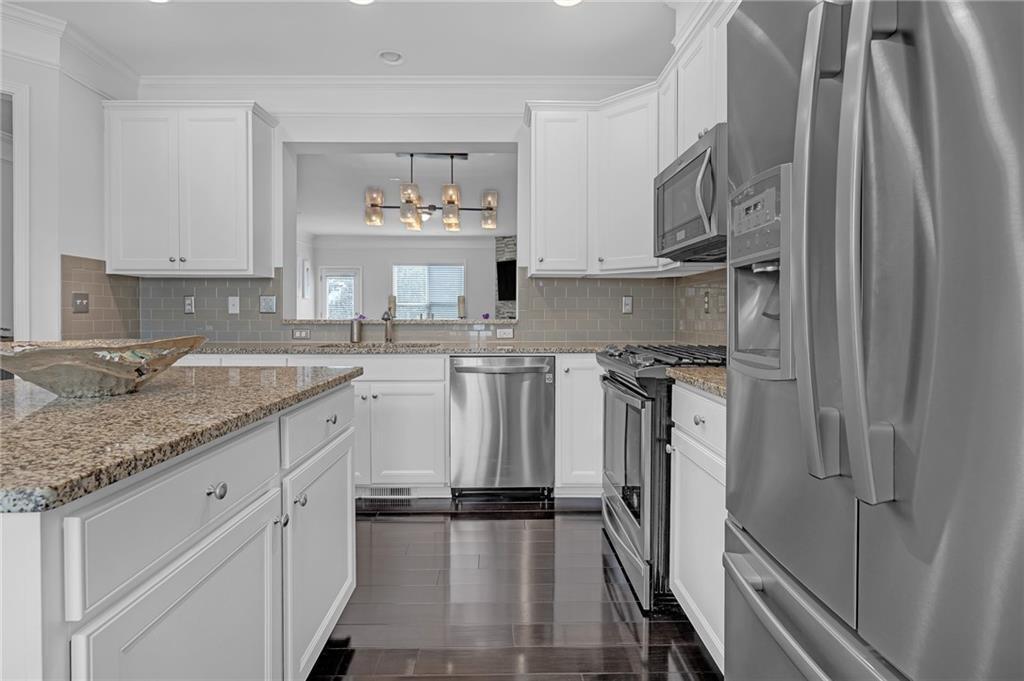 6513 Bennington Bluff Court, Unit 2 Mableton, GA 30126 - Photo 12 of 41 a kitchen with stainless steel appliances granite countertop a sink stove and refrigerator