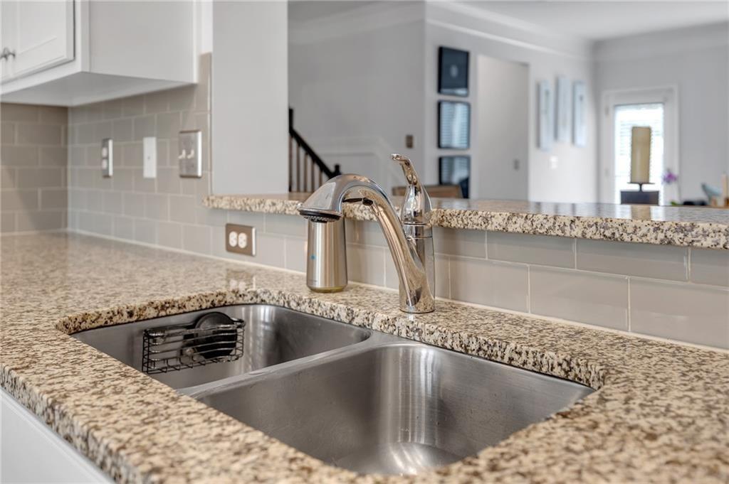 6513 Bennington Bluff Court, Unit 2 Mableton, GA 30126 - Photo 14 of 41 a kitchen with a sink a counter top space and stainless steel appliances