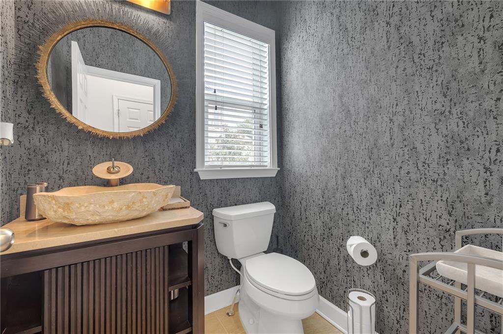 6513 Bennington Bluff Court, Unit 2 Mableton, GA 30126 - Photo 16 of 41 a bathroom with a toilet a sink and mirror