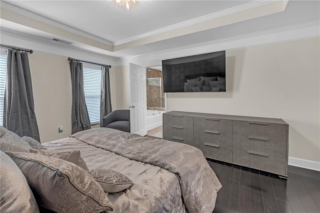 6513 Bennington Bluff Court, Unit 2 Mableton, GA 30126 - Photo 20 of 41 a bedroom with a bed and a flat screen tv