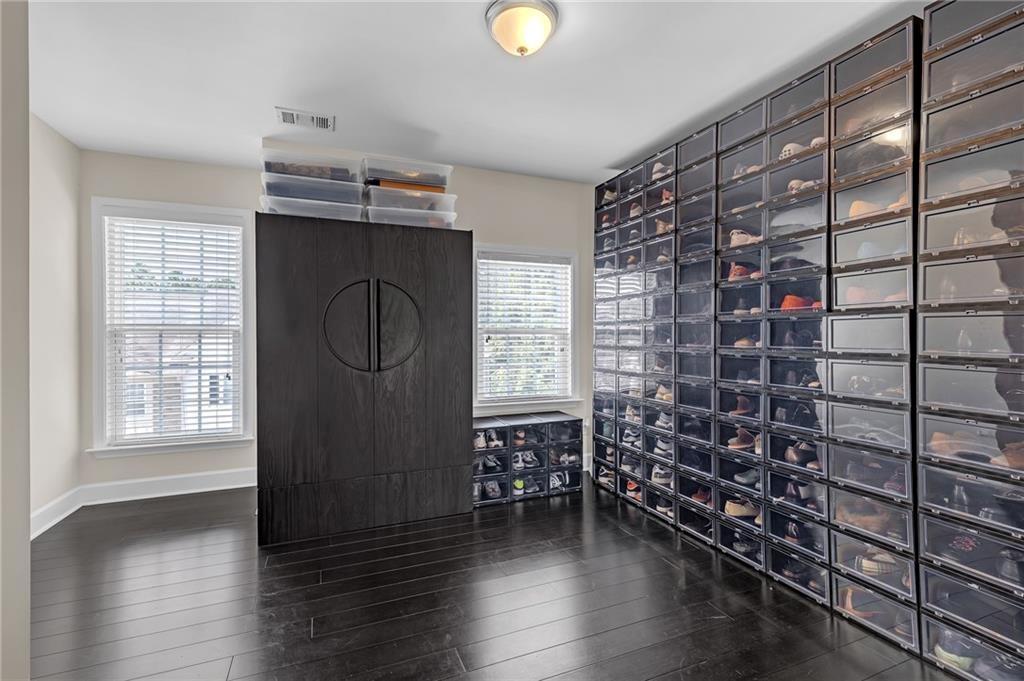 6513 Bennington Bluff Court, Unit 2 Mableton, GA 30126 - Photo 23 of 41 a view of empty room with wooden floor and fan