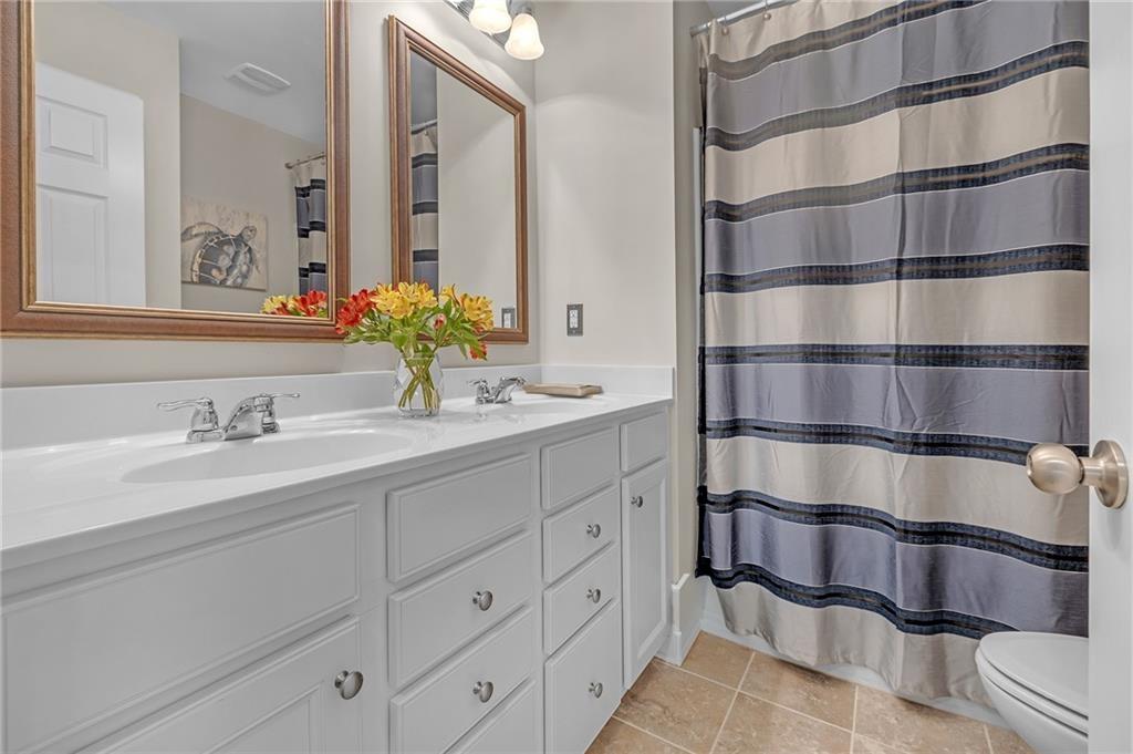 6513 Bennington Bluff Court, Unit 2 Mableton, GA 30126 - Photo 24 of 41 a bathroom with a double vanity sink and a mirror