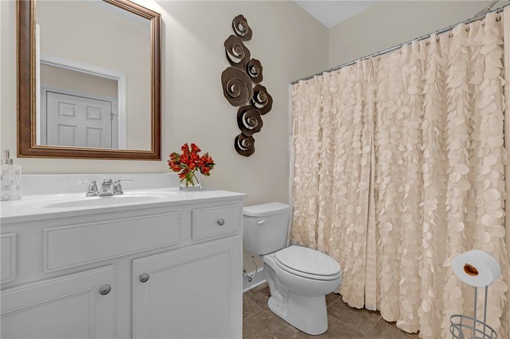 6513 Bennington Bluff Court, Unit 2 Mableton, GA 30126 - Photo 28 of 41 a bathroom with a toilet a sink and curtain