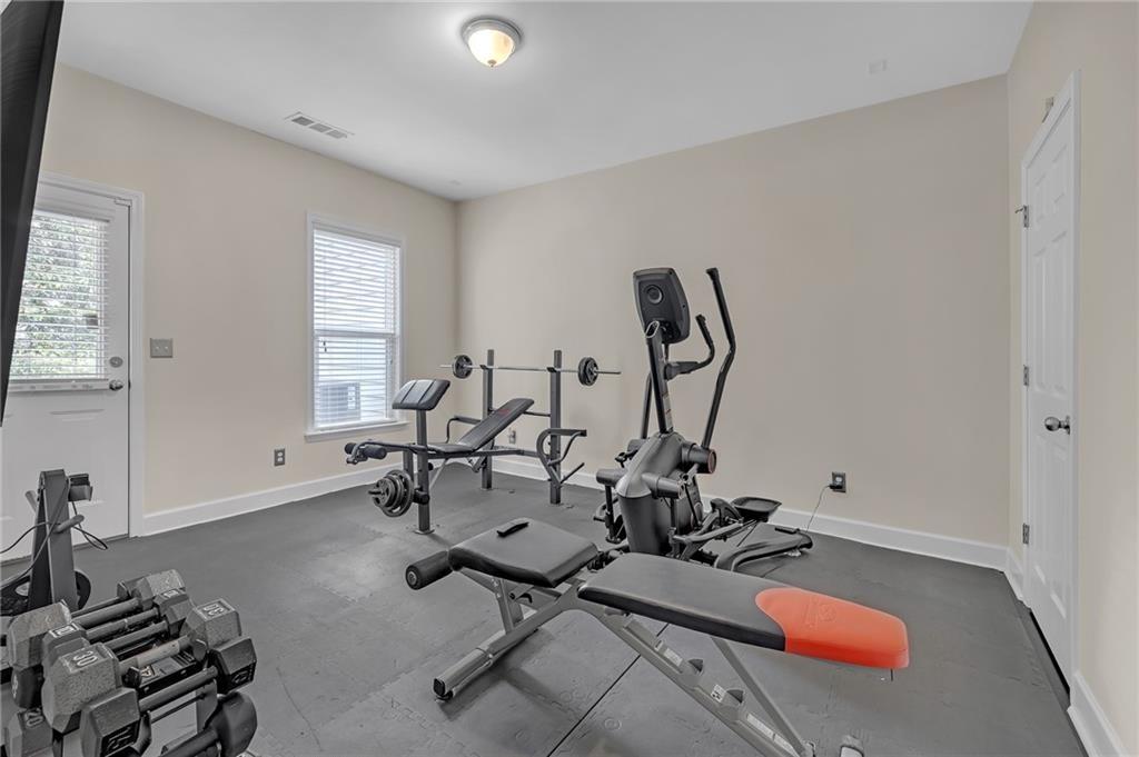 6513 Bennington Bluff Court, Unit 2 Mableton, GA 30126 - Photo 29 of 41 a room with gym equipment and a mirror