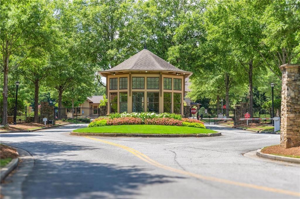 6513 Bennington Bluff Court, Unit 2 Mableton, GA 30126 - Photo 38 of 41 a front view of a house with a yard and trees