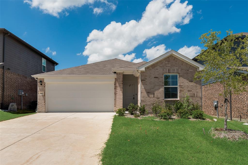 3407 Rendezvous Way Sherman, TX 75090 - Photo 2 of 17 Brick facade home featuring an attached two-car garage, concrete driveway, front entry door, and a single window with white trim