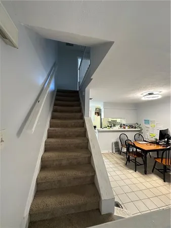 a view of a hallway with staircase