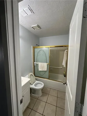 a bedroom with a bed and a walk in closet