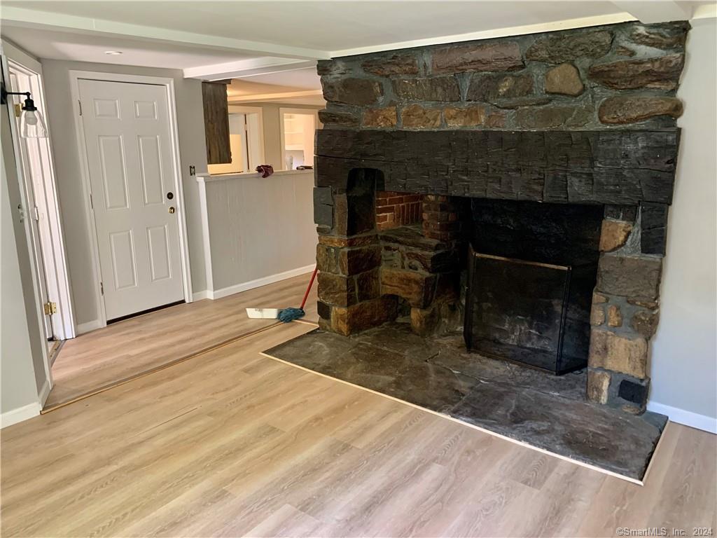 551 North Main Street, Unit 1R Naugatuck, CT 06770 - Photo 2 of 13 a living room with a fireplace