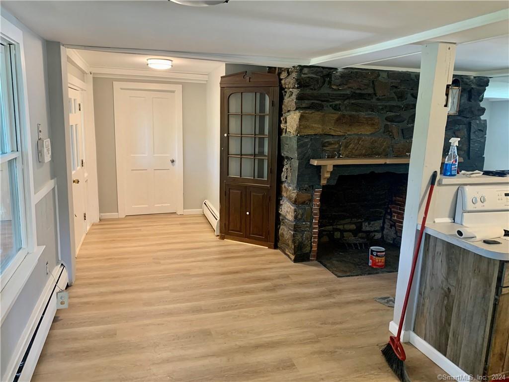 551 North Main Street, Unit 1R Naugatuck, CT 06770 - Photo 4 of 13 a bedroom with a bed and a mirror