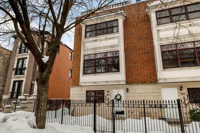 2651 West Rice Street Chicago, IL 60622 - Photo 1 of 20 a front view of a house with a tree