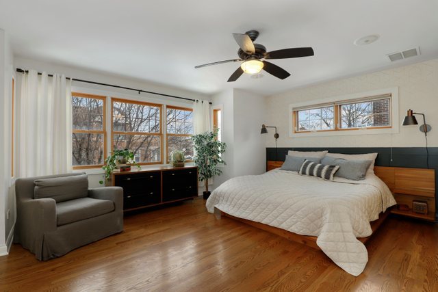 2651 West Rice Street Chicago, IL 60622 - Photo 13 of 20 a bedroom with a large bed and a couch
