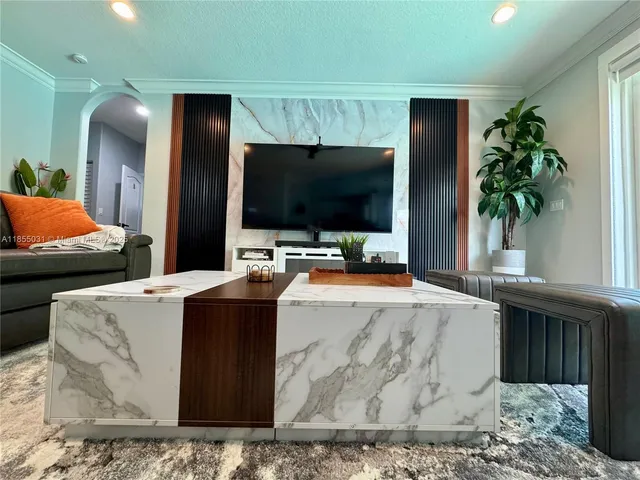a kitchen with stainless steel appliances white cabinets and a stove