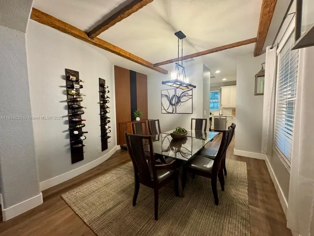 a living room with furniture and a clock