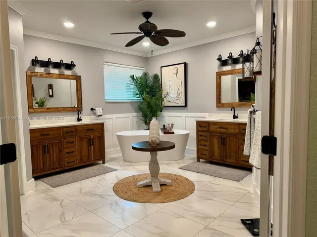 a bathroom with a sink a large mirror and a toilet
