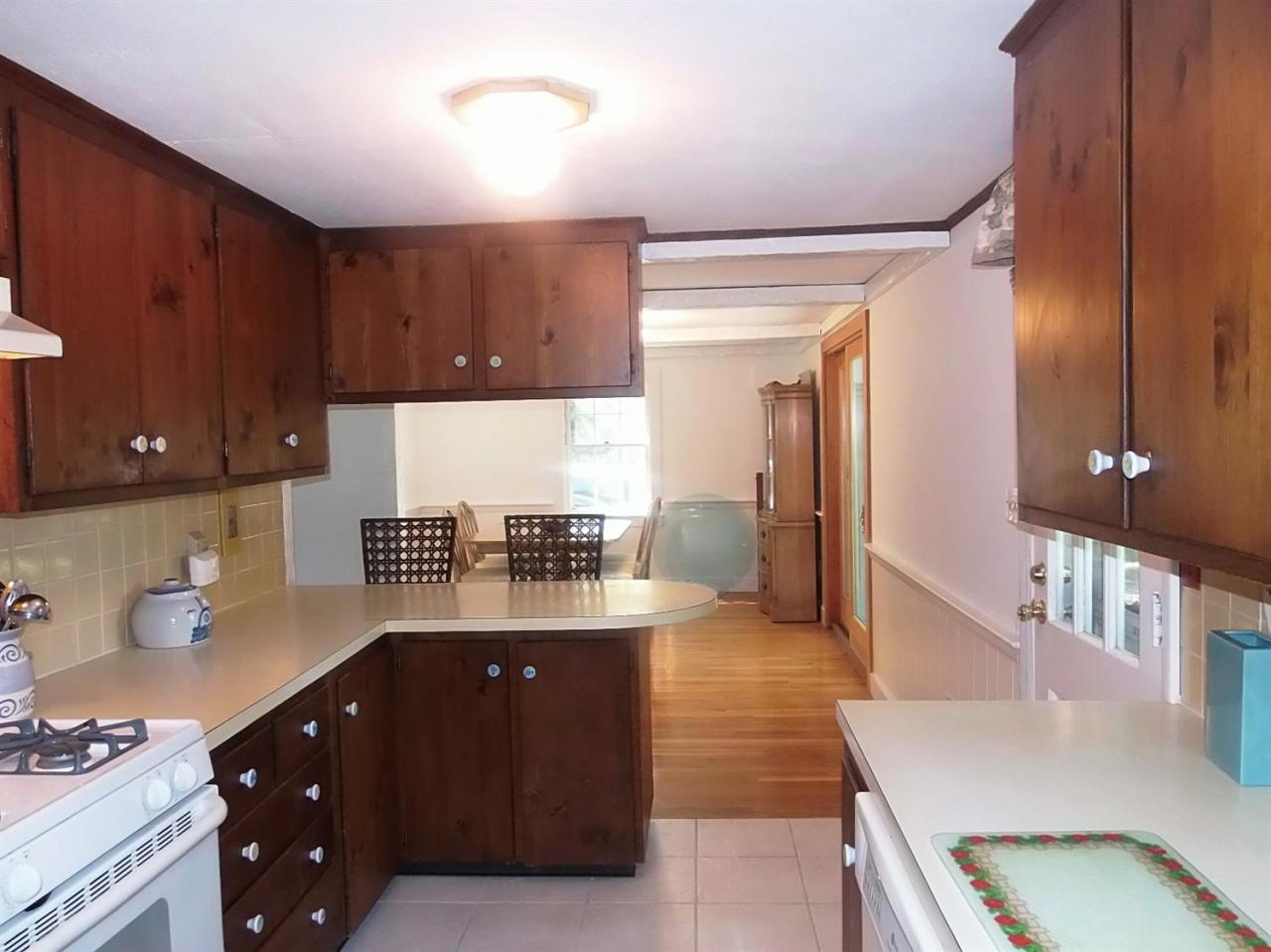 41 Edgewood Road Hyannis, MA 02601 - Photo 3 of 17 a kitchen with a refrigerator and a stove top oven
