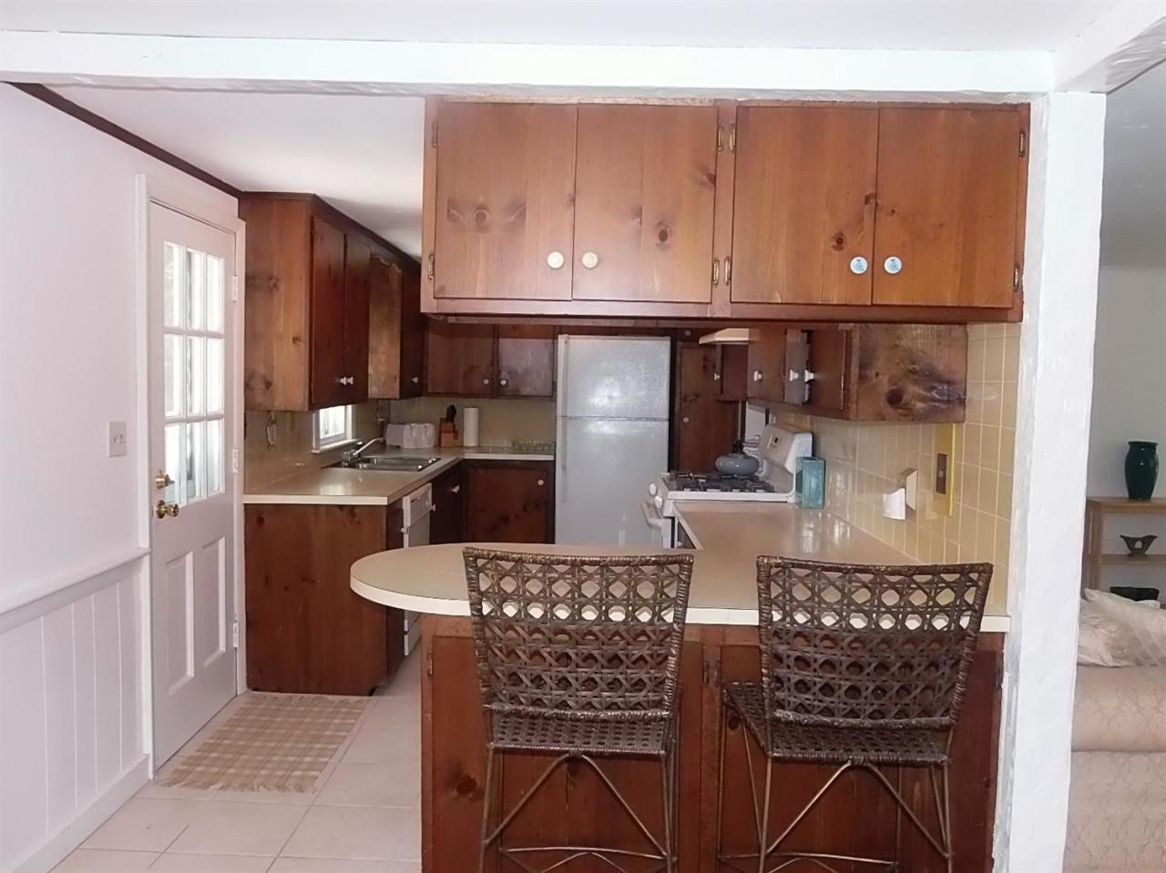 41 Edgewood Road Hyannis, MA 02601 - Photo 4 of 17 a kitchen with a table and chairs