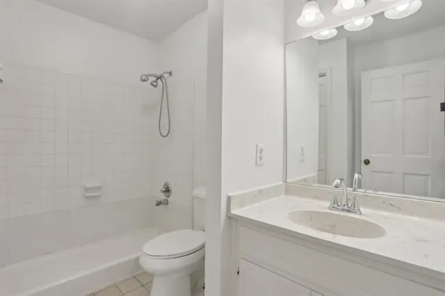 a bathroom with a sink a mirror and shower