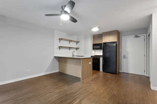a kitchen with stainless steel appliances a refrigerator and a refrigerator