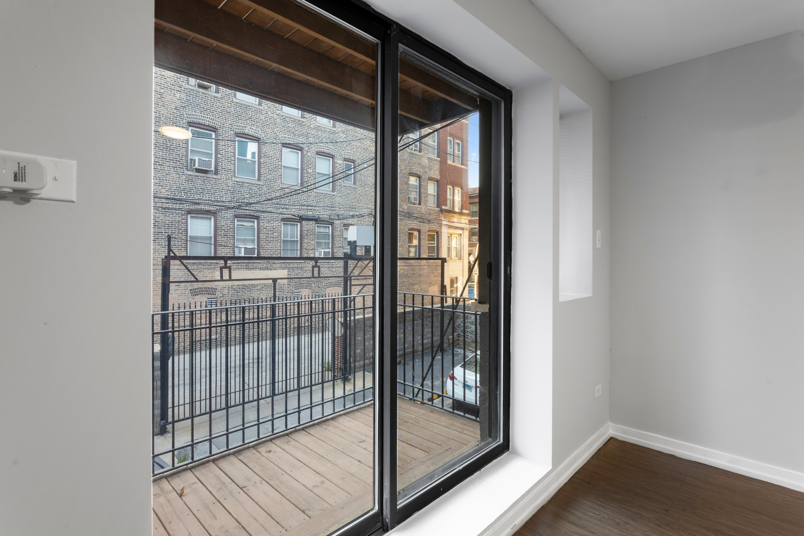 5411 North Winthrop Avenue, Unit 513 Chicago, IL 60640 - Photo 6 of 14 a view of a glass door and the window